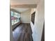 Sunroom with new wood laminate flooring, accented by a colorful stained-glass mosaic at 7403 Foxbloom Dr, Port Richey, FL 34668