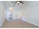 Spacious bedroom with hardwood flooring and a ceiling fan at 4907 Parson Brown Ln, Palm Harbor, FL 34684