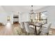 Open concept dining room featuring a modern light fixture, and stylish decor at 4907 Parson Brown Ln, Palm Harbor, FL 34684