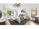 Bright main bedroom offers backyard views and a sliding door to the outside at 4907 Parson Brown Ln, Palm Harbor, FL 34684