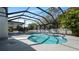 Backyard pool inside screened in patio at 4907 Parson Brown Ln, Palm Harbor, FL 34684