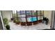 A balcony with potted plants and a view of the building pool, ideal for relaxation at 215 Valencia Blvd # 212, Belleair Bluffs, FL 33770