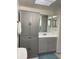 Bathroom with vanity, sink, and storage cabinet at 215 Valencia Blvd # 212, Belleair Bluffs, FL 33770