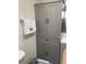 Bathroom featuring a gray cabinet, white towel, and clean fixtures, offering functionality at 215 Valencia Blvd # 212, Belleair Bluffs, FL 33770