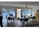 Spacious dining area with multiple tables, great for entertaining, near the community pool at 215 Valencia Blvd # 212, Belleair Bluffs, FL 33770