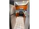 Modern kitchen with stainless steel appliances and tile flooring at 215 Valencia Blvd # 212, Belleair Bluffs, FL 33770