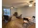 Bright living area with a recliner and view of the sliding glass door at 215 Valencia Blvd # 212, Belleair Bluffs, FL 33770