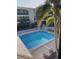 High-angle shot of the community pool shows proximity to units at 215 Valencia Blvd # 212, Belleair Bluffs, FL 33770