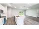 Bright, open kitchen features a central island and stainless steel appliances, flowing into the living area at 104 Australian Dr, Rotonda West, FL 33947