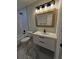 Stylish bathroom featuring modern fixtures, elegant mirror and floating vanity at 460 Creek Lane Dr, Englewood, FL 34223