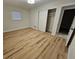 Spacious bedroom includes wood flooring, closet, and plenty of natural light at 460 Creek Lane Dr, Englewood, FL 34223