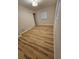 Inviting bedroom features wood flooring, closet, and a bright window at 460 Creek Lane Dr, Englewood, FL 34223