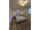 Comfortable bedroom with wood flooring, a neutral color scheme, and windows for natural light at 460 Creek Lane Dr, Englewood, FL 34223