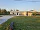 Charming single-story home with carport, fresh paint, modern accents, and a spacious yard at 460 Creek Lane Dr, Englewood, FL 34223