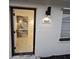 Inviting front entrance showcasing the house number, modern lighting, and interior design elements at 460 Creek Lane Dr, Englewood, FL 34223