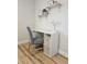 Cozy home office area features a functional white desk with storage and shelves at 460 Creek Lane Dr, Englewood, FL 34223
