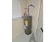 Energy-efficient water heater unit installed indoors, near a window and a door at 460 Creek Lane Dr, Englewood, FL 34223