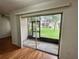 Screened patio offers a relaxing view of the landscaped lawn and mature trees at 7522 Needle Leaf Pl # 27, Tampa, FL 33617