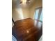 Bedroom with hardwood floors, neutral walls, ceiling fan, and glass doors to outdoor area at 7139 Colony Pointe Dr, Riverview, FL 33578