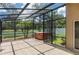 Spacious screened-in lanai with a hot tub, offering a relaxing outdoor living space and privacy at 7139 Colony Pointe Dr, Riverview, FL 33578