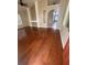 Living room features hardwood floors, built-in shelving, and is well-lit from many windows at 7139 Colony Pointe Dr, Riverview, FL 33578