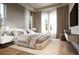 Serene main bedroom featuring a king-size bed, light-colored walls and oversized window at 125 Baytree Dr, Rotonda West, FL 33947