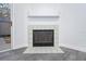 Cozy fireplace with hearth and tiled surround, next to the sliding door at 133 A C L St, Brooksville, FL 34601