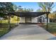 Charming home featuring a carport, well-manicured lawn and a inviting double door entry way at 133 A C L St, Brooksville, FL 34601