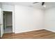 Bedroom features vinyl floors and entry to the bathroom at 7316 Samuel Ivy Dr, Tampa, FL 33619