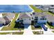 Aerial view of a beautifully landscaped home with a spacious backyard, and a well-maintained lawn at 1236 7Th Nw Ave, Ruskin, FL 33570