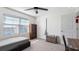 Bright bedroom featuring carpet floors, natural light, and a closet at 7522 Rosewood Garden Loop, Tampa, FL 33637
