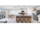 Stylish kitchen with an island, bar stools, stainless steel appliances, and easy access to the outdoor patio via sliding doors at 7522 Rosewood Garden Loop, Tampa, FL 33637