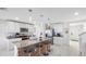 Charming kitchen featuring a large island with bar seating, stainless steel appliances, and ample cabinet space at 7522 Rosewood Garden Loop, Tampa, FL 33637