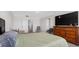 Large carpeted main bedroom with a dresser, chairs, and bedroom at 7522 Rosewood Garden Loop, Tampa, FL 33637