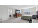 A carpeted main bedroom with a dresser, chairs, and a bedroom at 7522 Rosewood Garden Loop, Tampa, FL 33637