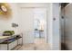 Hallway leading to a living space with a console table, mirror, and modern design at 15 Avalon St St # 803, Clearwater Beach, FL 33767