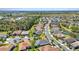 Captivating aerial view of a residential area showcasing a beautiful home with palm trees and lush landscaping at 2640 Suncoast Lakes Blvd, Punta Gorda, FL 33980