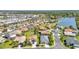 Picturesque aerial view of a neighborhood showcasing homes near a beautiful lake at 2640 Suncoast Lakes Blvd, Punta Gorda, FL 33980