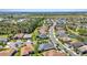Aerial view of homes near lake, showcasing lush landscaping and charming community at 2640 Suncoast Lakes Blvd, Punta Gorda, FL 33980