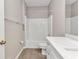 Clean bathroom showcasing a marble vanity, modern fixtures, and a shower-tub combination at 2640 Suncoast Lakes Blvd, Punta Gorda, FL 33980