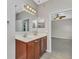 Bathroom with double sink vanity and a shower at 2640 Suncoast Lakes Blvd, Punta Gorda, FL 33980