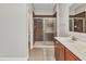 Bathroom featuring a glass enclosed shower and wood cabinets at 2640 Suncoast Lakes Blvd, Punta Gorda, FL 33980