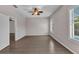 Spacious bedroom featuring wood-look tile and natural light at 2640 Suncoast Lakes Blvd, Punta Gorda, FL 33980