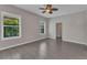 Bright, airy bedroom with natural light, tile flooring, and a glimpse of the outdoors through the windows at 2640 Suncoast Lakes Blvd, Punta Gorda, FL 33980