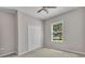 Cozy bedroom featuring a window with blinds and a closet at 2640 Suncoast Lakes Blvd, Punta Gorda, FL 33980