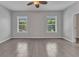 Large room with beautiful floors, natural light, and neutral walls offers versatility and comfort at 2640 Suncoast Lakes Blvd, Punta Gorda, FL 33980