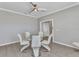 Bright dining room with modern light fixture and table set at 2640 Suncoast Lakes Blvd, Punta Gorda, FL 33980