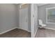 Inviting entryway features a white front door and wood-look tile flooring at 2640 Suncoast Lakes Blvd, Punta Gorda, FL 33980