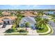 Charming single-story home with a well-manicured lawn and palm trees, showcasing curb appeal and inviting charm at 2640 Suncoast Lakes Blvd, Punta Gorda, FL 33980