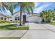 Charming single-story home featuring a well-maintained lawn and a two-car garage at 2640 Suncoast Lakes Blvd, Punta Gorda, FL 33980